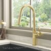 Ruvati Isola Single Handle Pull Out Kitchen Faucet Knurl Transitional with Sprayer in Brushed Gold - RVF1248SG